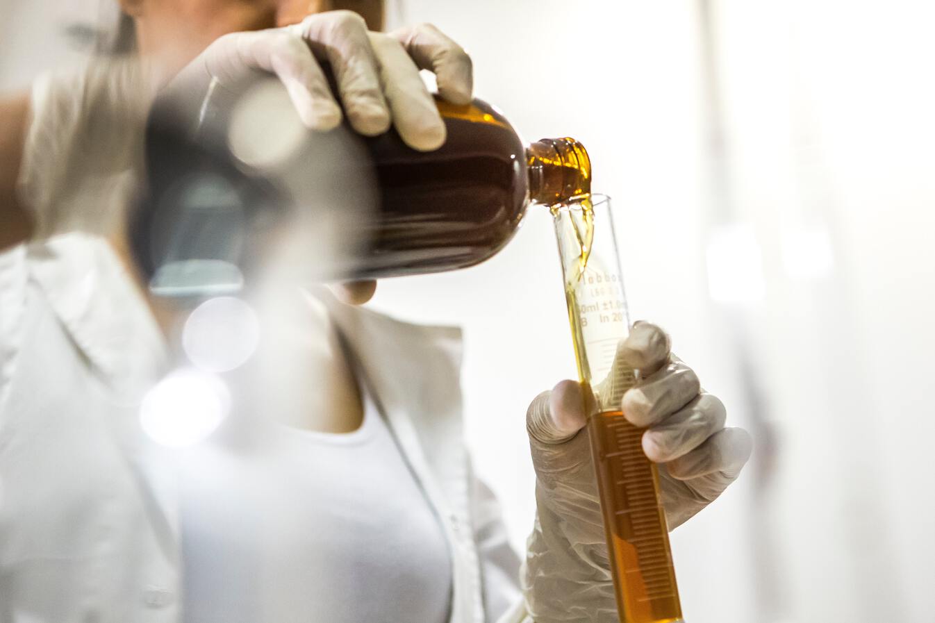 Oil pouring into bottle