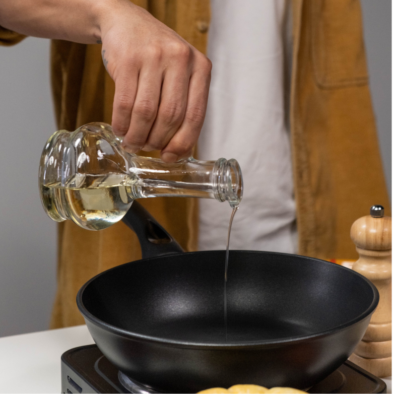 Oil pouring into pan